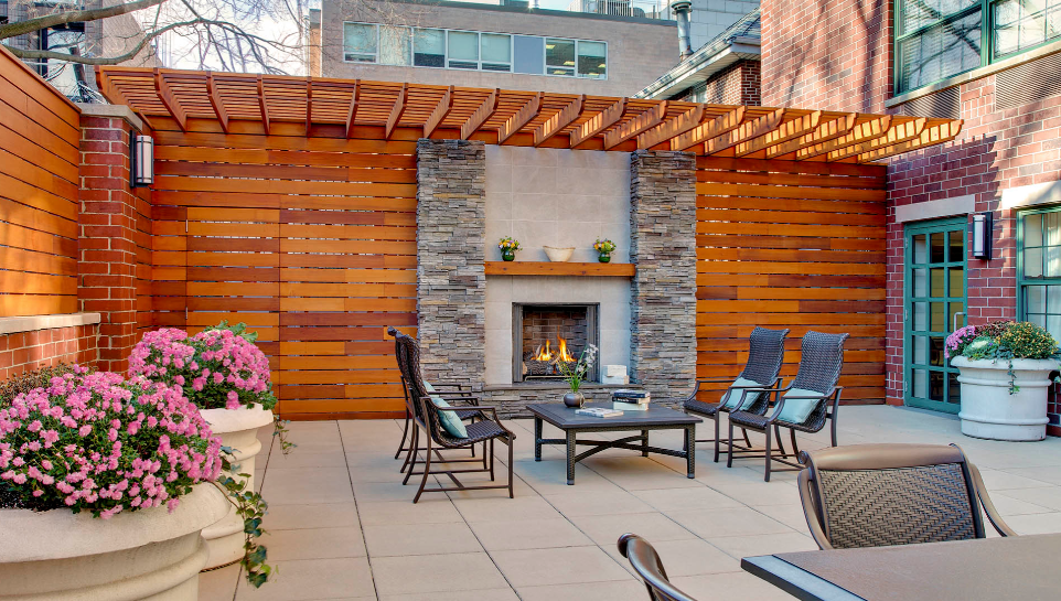 image of Atria Riverdale courtyard with outdoor fireplace